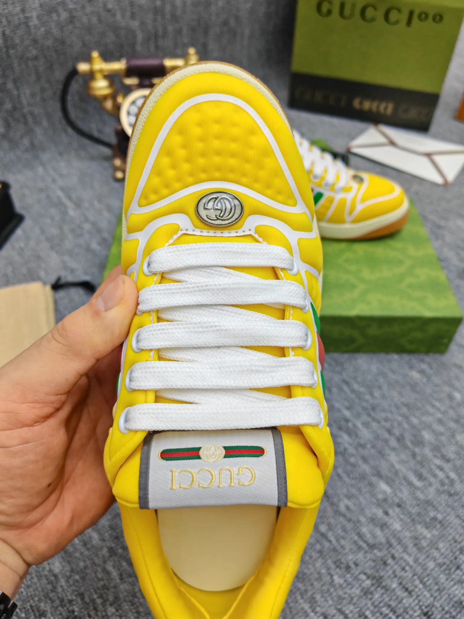 Factory price 600💰Screener series embellished web sneakers. This item is from the Gucci Lido series. Its design is inspired by the summer style and beach clubs of the Italian coast. The Screener series of sneakers draws inspiration from classic sneakers from the 1970s and takes its name from a special defensive move in sports. This shoe from the 2024 Pre-Fall collection is crafted from yellow rubber, a technical and malleable opaque material, with striped webbing on the sides and an embossed Gucci printed logo on the heel. Yellow rubber, opaque and technological in appearance. Red and green webbing decorated with metal Double G oval enamel details. Gucci printed embossed logo. Women 35-40, men 38-45, (men 38 and 45 need to be customized)